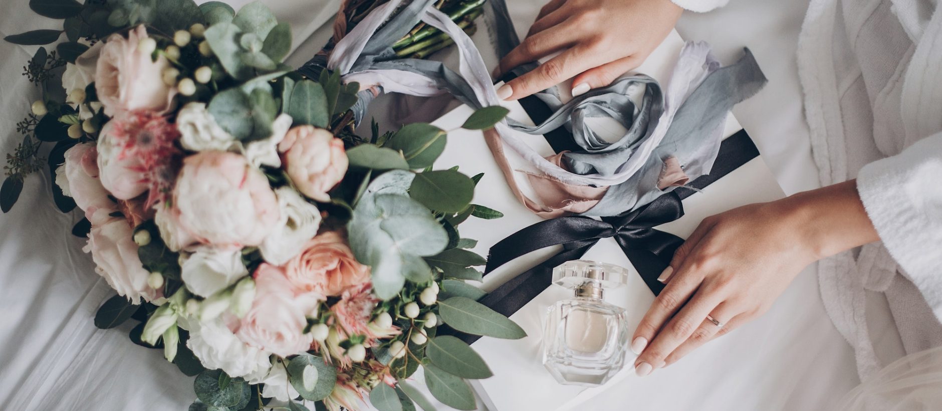 Modern wedding bouquet, perfume bottle, and gift box